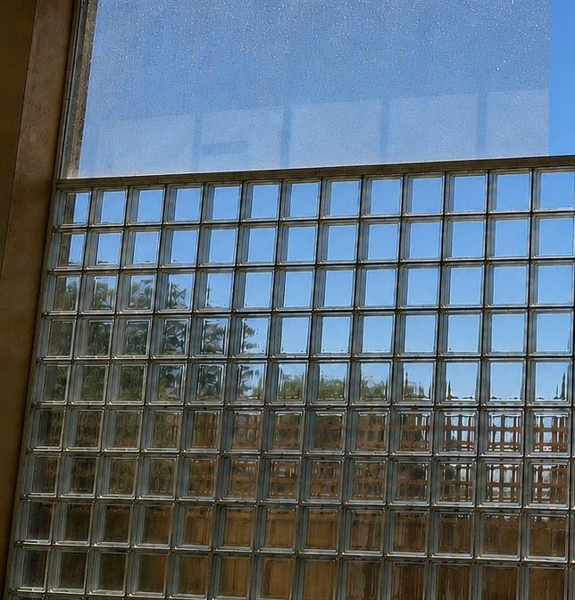 Dirty glass block window before Mint Window Cleaning service, pool area